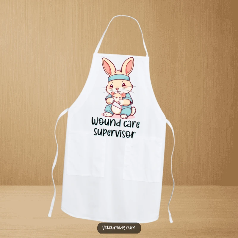 Funny apron showing a rabbit in scrubs bandaging a toy mouse, ideal for kitchen use with a caring theme.
